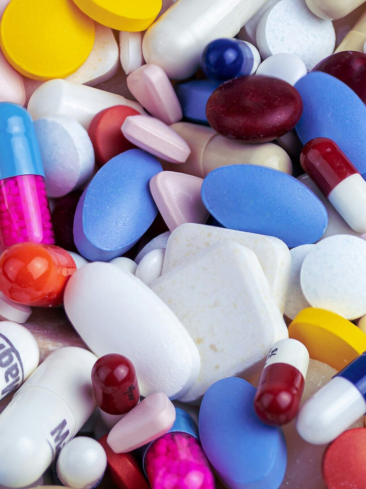 white blue and orange medication pill