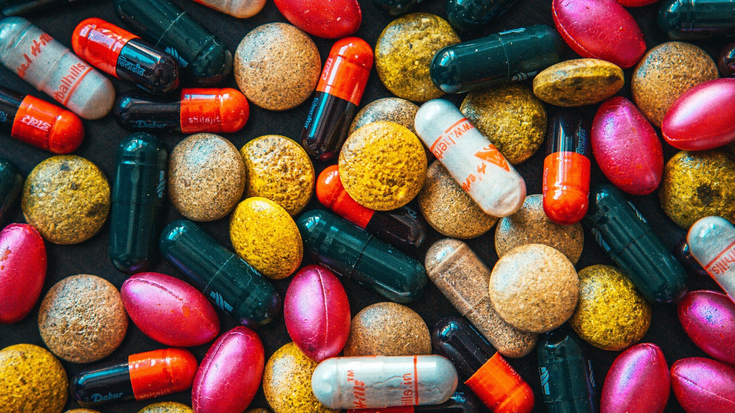 red and brown medication pill
