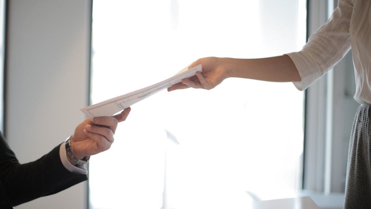 Job Applicant Passing Her Documents