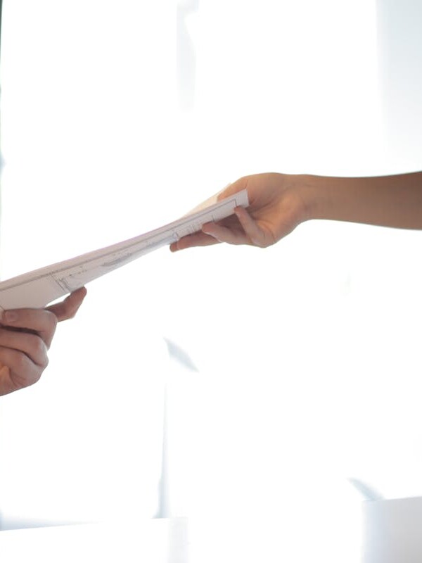 Job Applicant Passing Her Documents