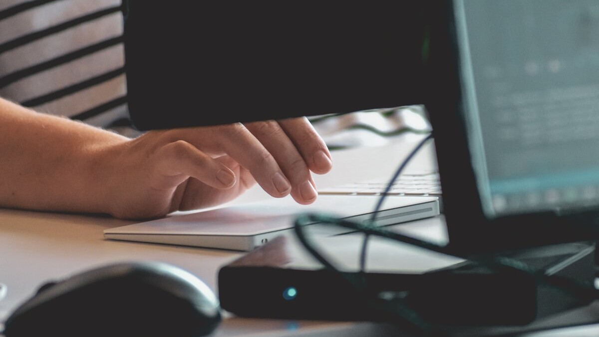 person using computer on table