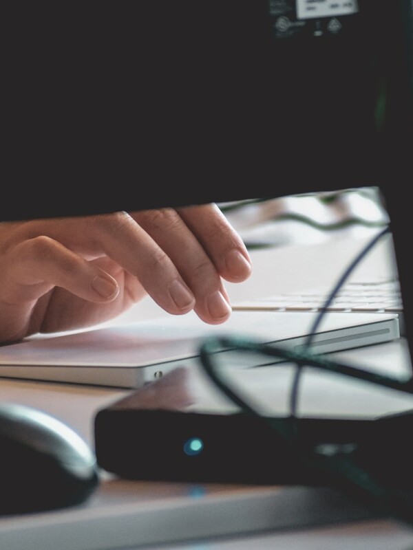 person using computer on table