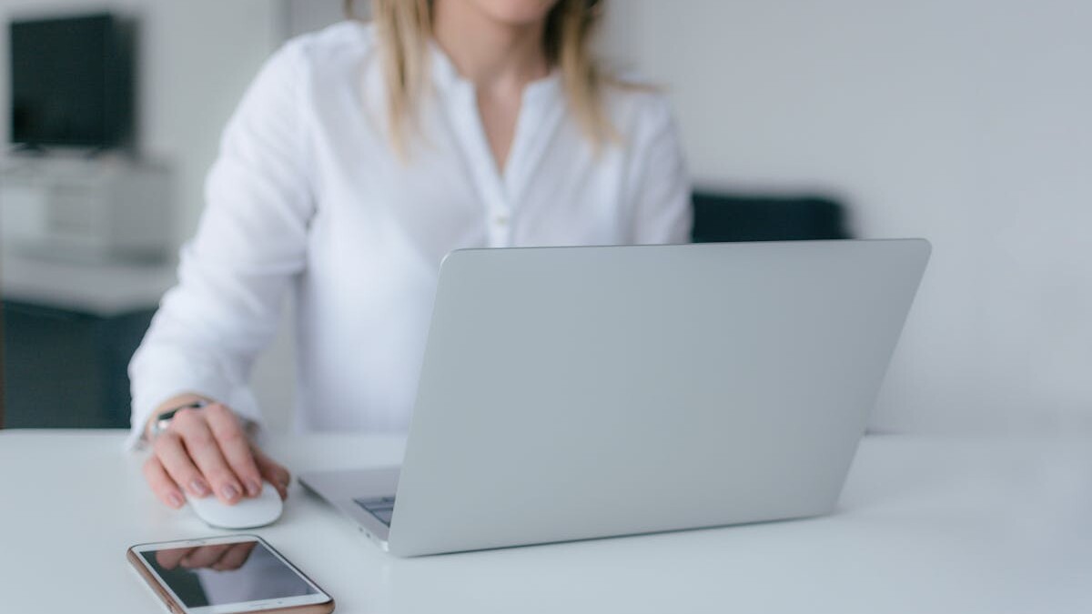 Woman Using Silver Laptop