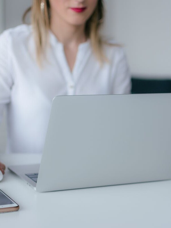 Woman Using Silver Laptop