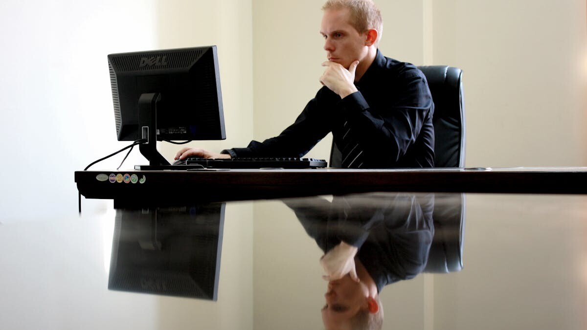 Man Sitting Facing Pc Inside Room