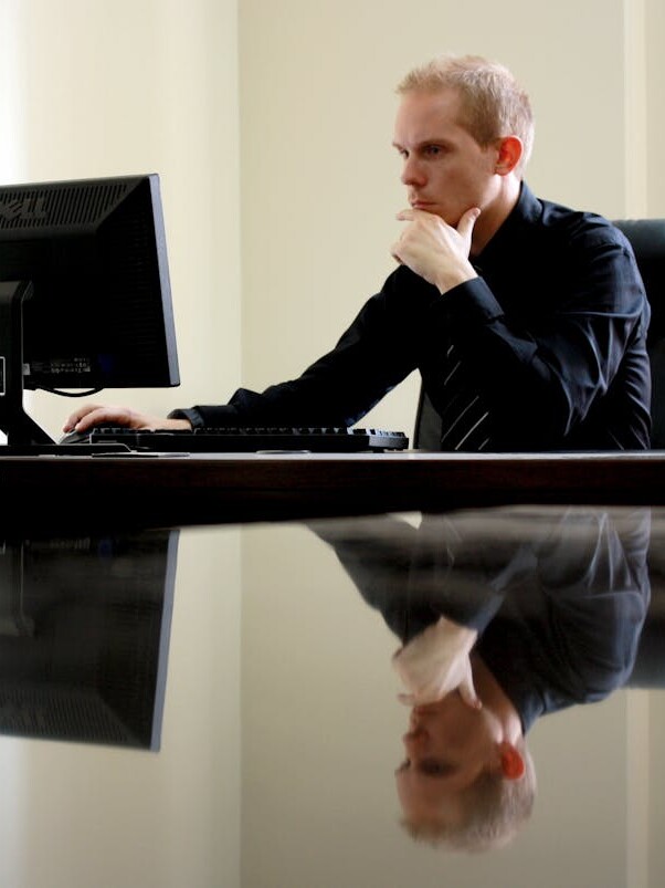 Man Sitting Facing Pc Inside Room