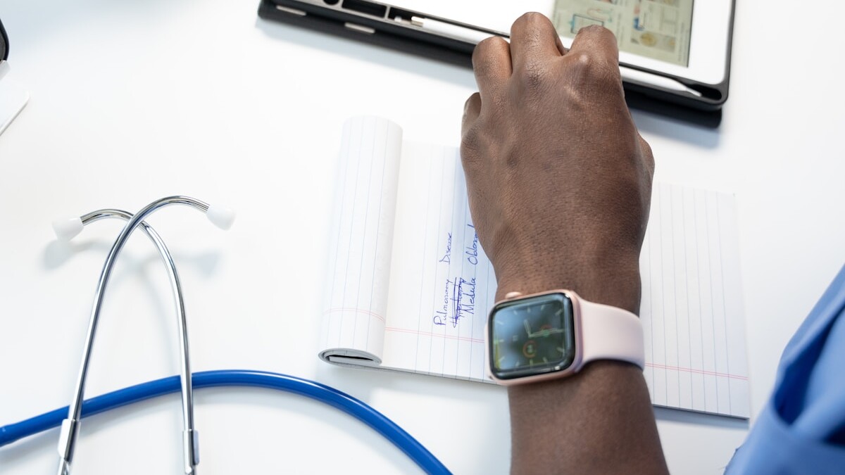 a hand holding a smart watch