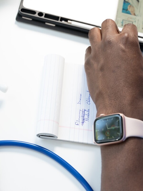 a hand holding a smart watch